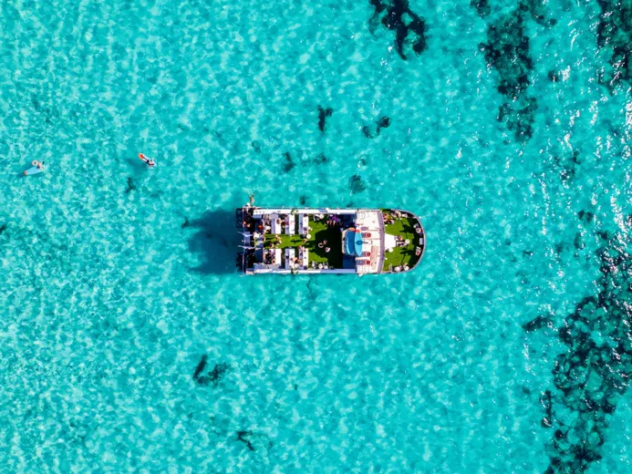 Party boat on turquoise water, Formentera